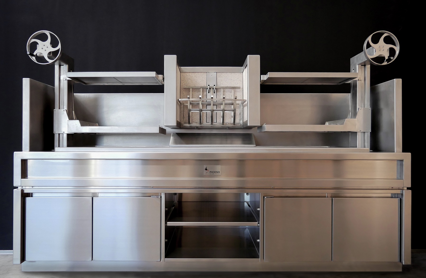 Custom grilling station with adjustable wheel grills, central fire grate - Fiamma@Capella Singapore